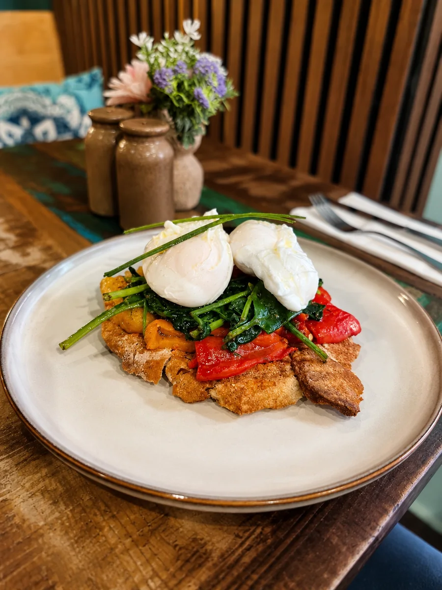 Poached eggs with greens and roasted peppers on toast at 26 Elvet