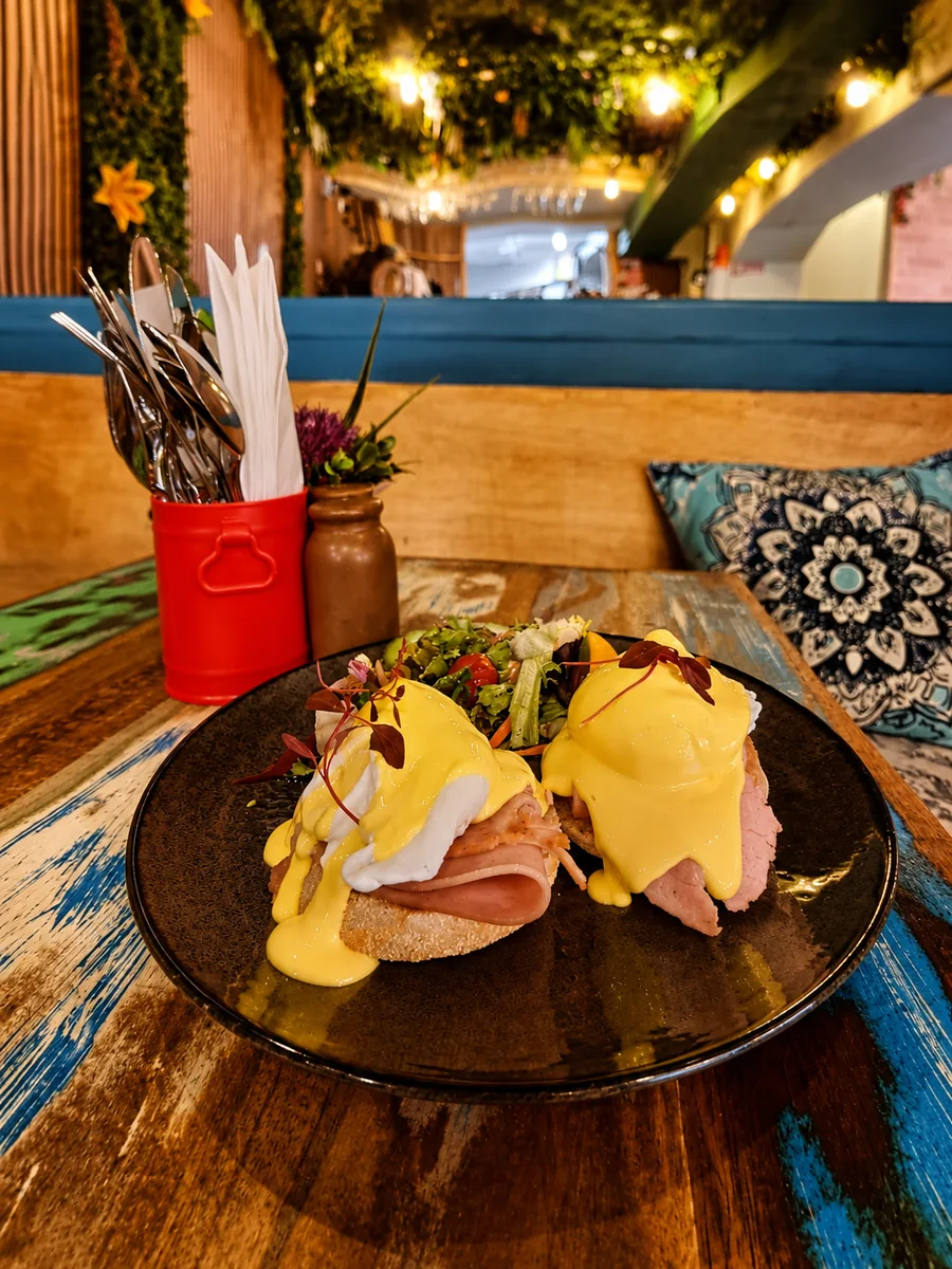 Eggs Benedict served inside the colourful 26 Elvet café